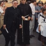 Don Luigi Mancini, a sinistra nella foto
